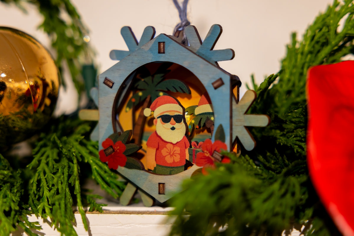 Decorative 3D Christmas ornament with a tropical Santa Claus design, surrounded by greenery and other ornaments.