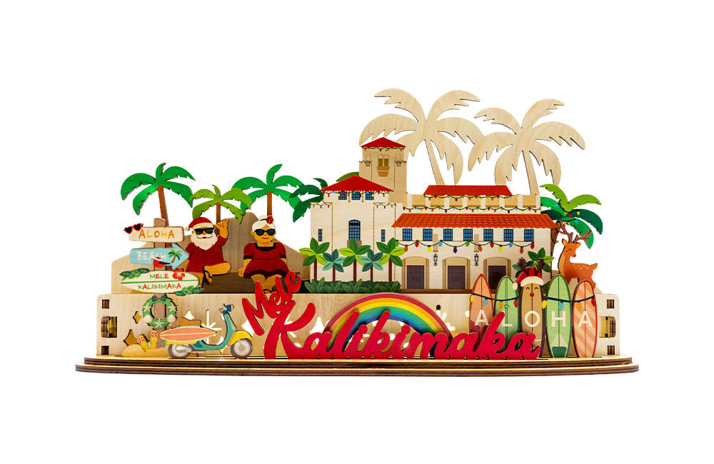 3D sign of Honolulu Hale building with Shaka Santa and Mrs Clause characters and 'Aloha' sign on a white background