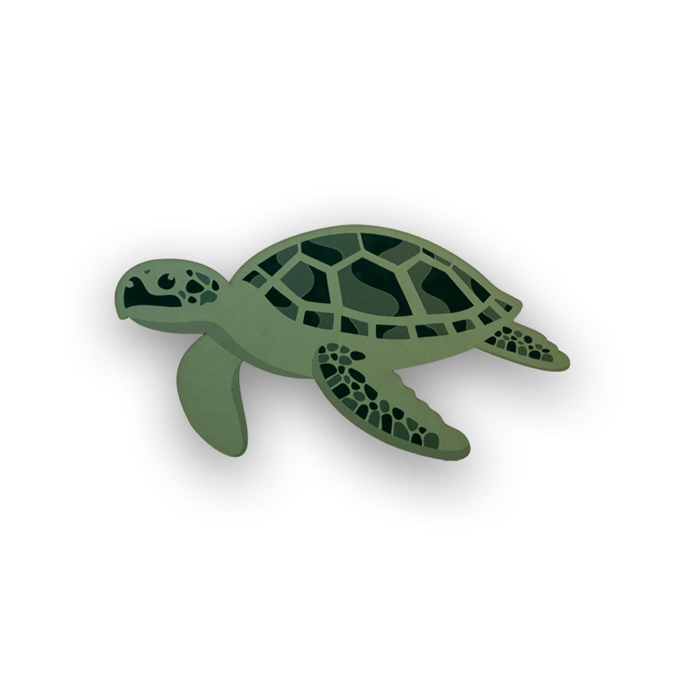 Green turtle wood cutout on a white background