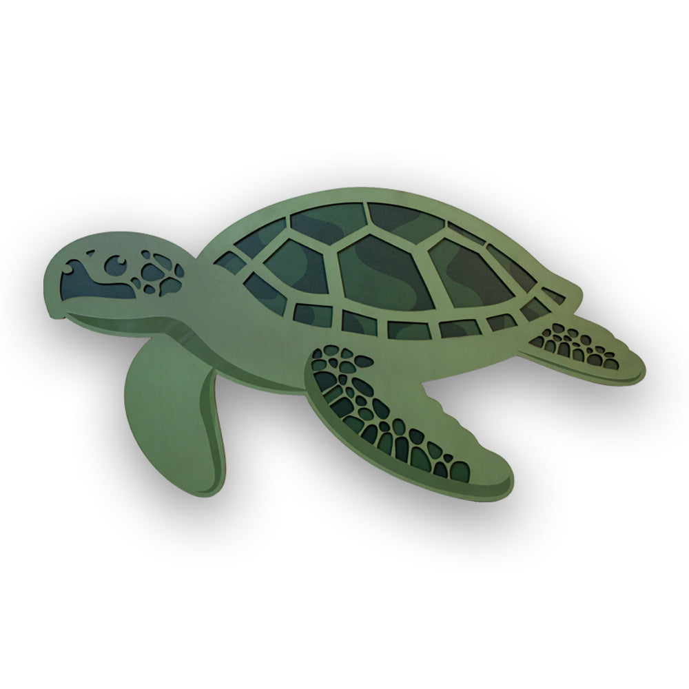 Green turtle-shaped double layered wall decor on a white background