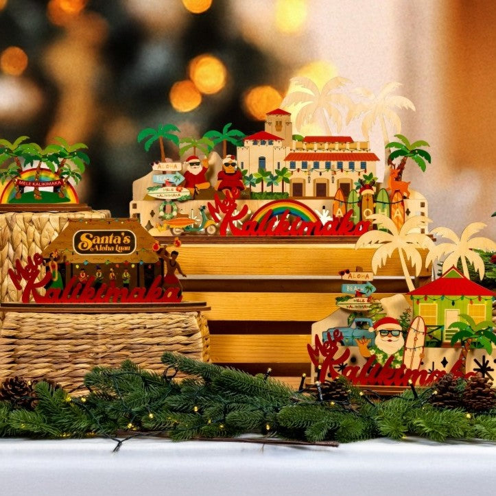 Decorative Christmas scene with Santa's Village set, palm trees, and tropical elements on a blurred background.