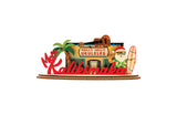 Decorative 3D holiday sign with 'Holly Jolly Ukuleles' shop and a Shaka Santa Claus figure holding a surfboard next to a palm tree on a white background.