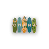 OHANA text on green and blue wood surfboards cut out on white background