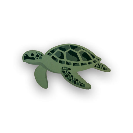 Green turtle wood cutout on a white background
